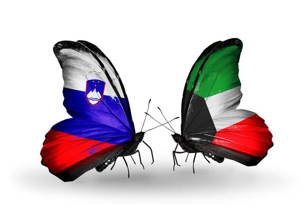 Butterflies with Slovenia and Kuwait flags — Stock Photo, Image