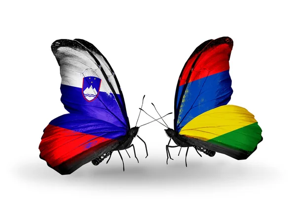 Butterflies with Slovenia and Mauritius flags — Stock Photo, Image