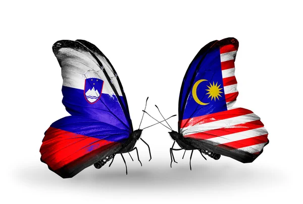 Butterflies with Slovenia and Malaysia flags — Stock Photo, Image