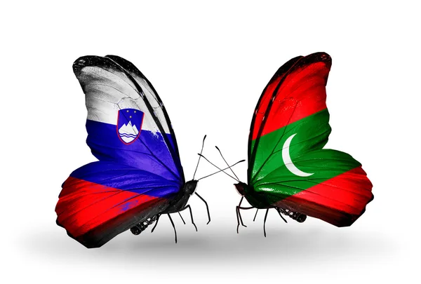 Butterflies with  Slovenia and Maldives flags — Stock Photo, Image