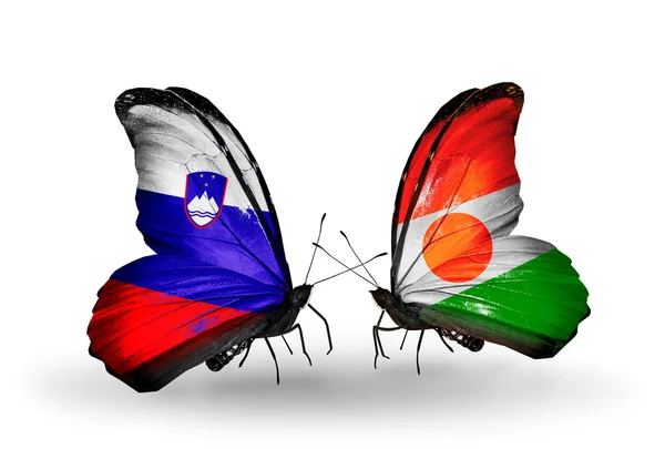 Butterflies with  Slovenia and Niger flags — Stock Photo, Image