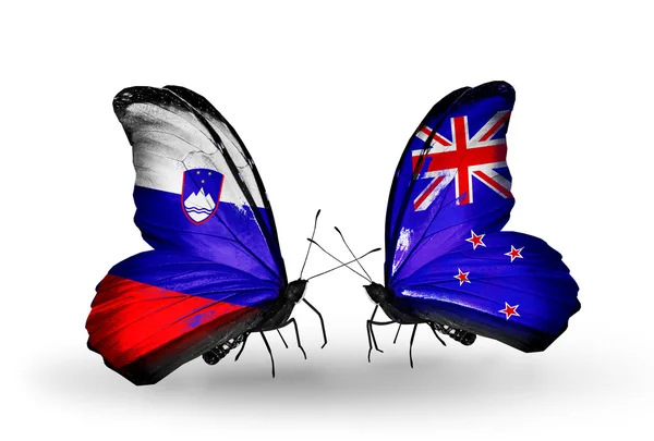 Butterflies with Slovenia and New Zealand flags — Stock Photo, Image