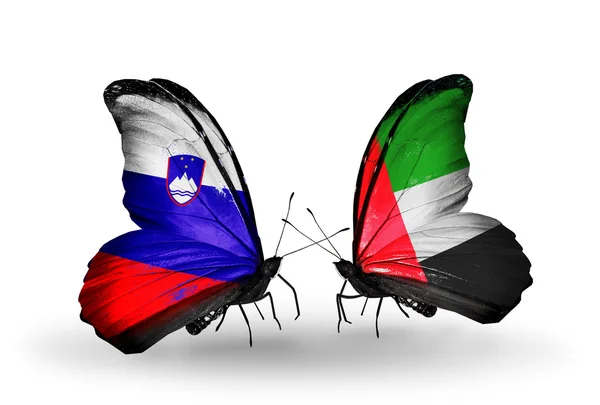 Butterflies with  Slovenia and UAE flags — Stock Photo, Image