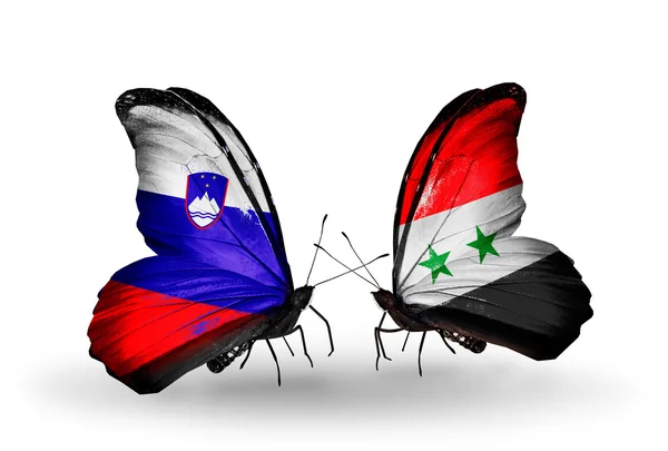 Butterflies with Slovenia and Syria flags — Stock Photo, Image