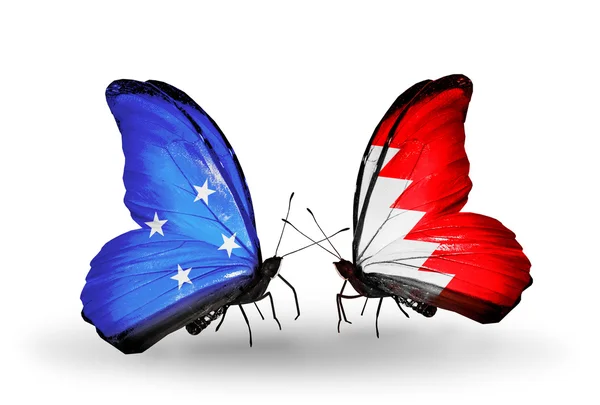 Farfalle con bandiere Micronesia e Bahrein — Foto Stock