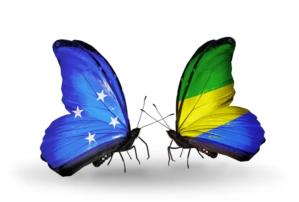 Butterflies with Micronesia and Gabon flags — Stock Photo, Image