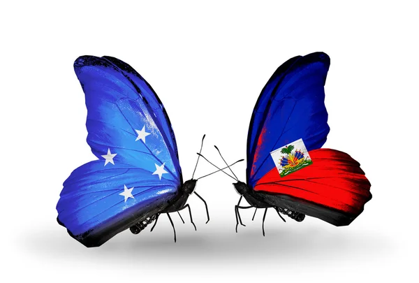 Borboletas com bandeiras da Micronésia e Haiti — Fotografia de Stock