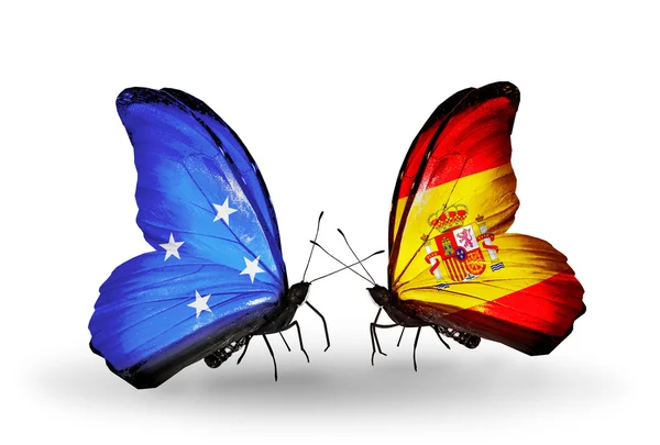 Butterflies with Micronesia and  Spain flags — Stock Photo, Image