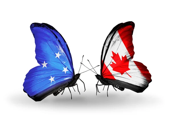 Mikronezya ve Kanada bayrakları taşıyan kelebekler — Stok fotoğraf
