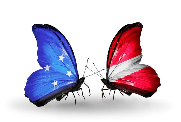 Butterflies with Micronesia and Latvia flags — Stock Photo, Image