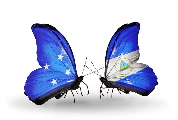 Butterflies with Micronesia and Nicaragua flags — Stock Photo, Image
