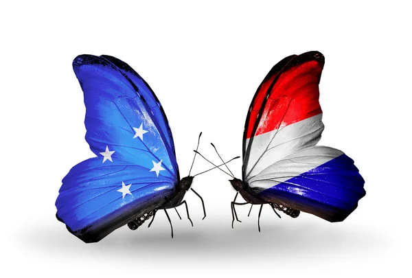 Butterflies with Micronesia and Holland flags — Stock Photo, Image