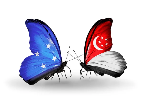 Butterflies with Micronesia and Singapore flags — Stock Photo, Image