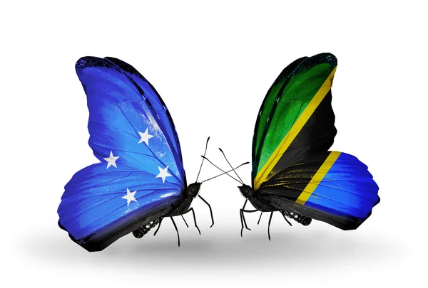 Motýli s příznaky Mikronésie a Tanzanie — Stock fotografie