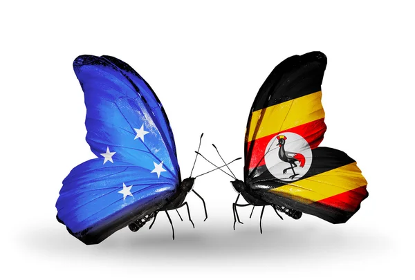Fjärilar med Mikronesien och Uganda flaggor — Stockfoto