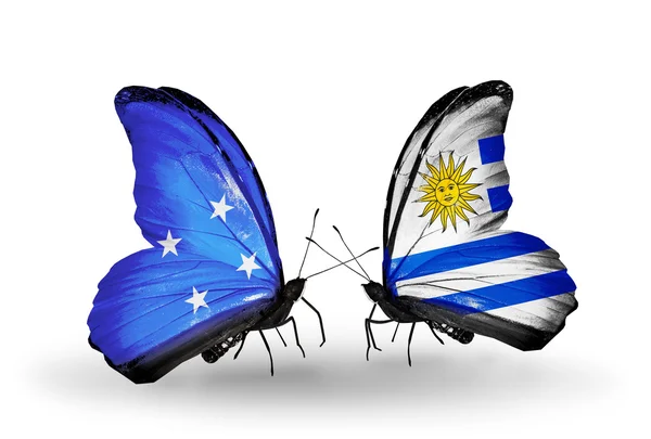 Borboletas com bandeiras da Micronésia e Uruguai — Fotografia de Stock