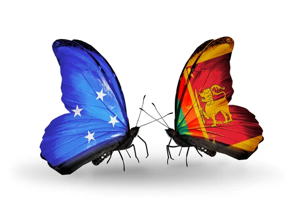 Бабочки с флагами Микронезии и Шри-Ланки — стоковое фото