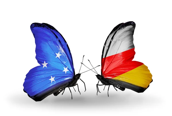 Butterflies with Micronesia and South Ossetia flags — Stock Photo, Image