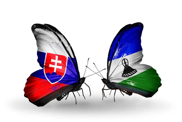 Butterflies with  Slovakia and Lesotho flags — Stock Photo, Image