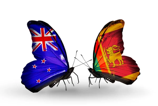 Schmetterlinge mit Neuseeland und Sri Lanka Fahnen — Stockfoto