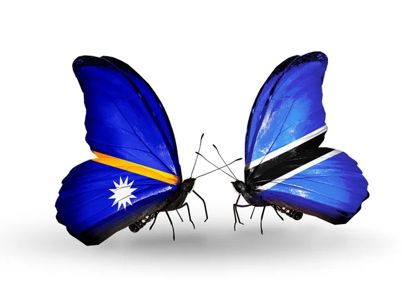 Butterflies with Nauru and  Botswana flags — Stock Photo, Image