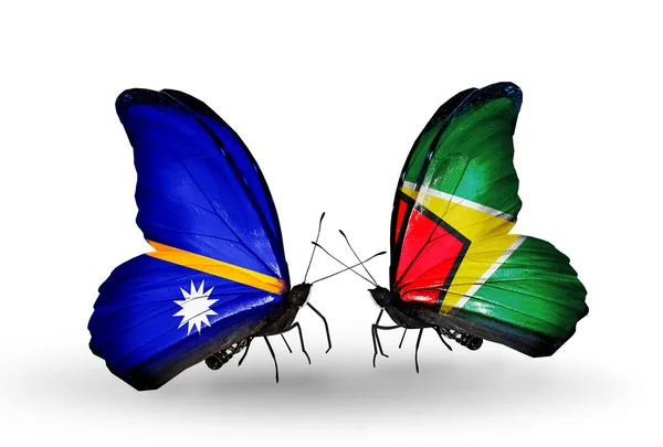 Farfalle con bandiere Nauru e Guyana — Foto Stock