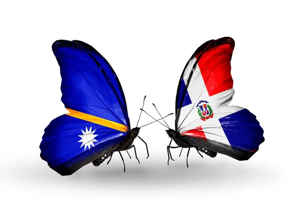 Butterflies with Nauru and Dominicana flags — Stock Photo, Image