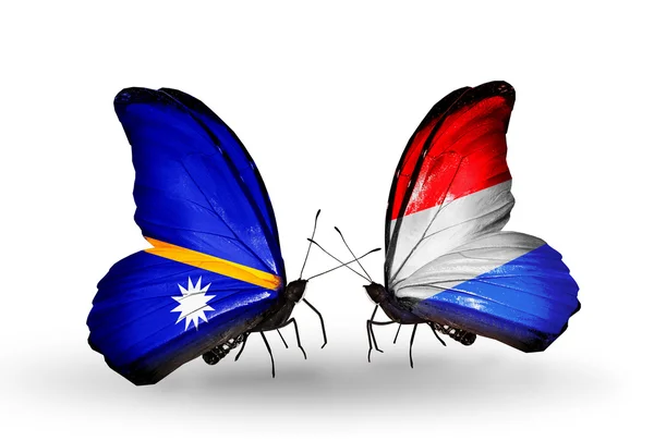 Butterflies with Nauru and Luxembourg flags — Stock Photo, Image