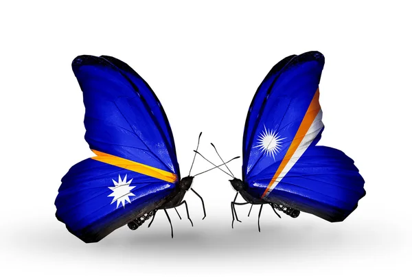 Butterflies with Nauru and Marshall islands flags — Stock Photo, Image