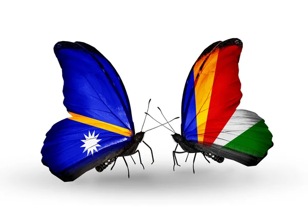 Butterflies with Nauru and Seychelles flags — Stock Photo, Image