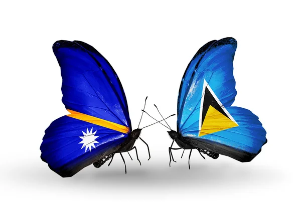 Butterflies with Nauru and Saint Lucia flags — Stock Photo, Image