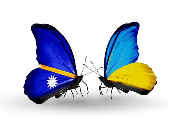 Butterflies with Nauru and Ukraine flags — Stock Photo, Image