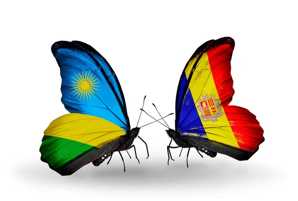 Butterflies with Rwanda and Andorra flags — Stock Photo, Image