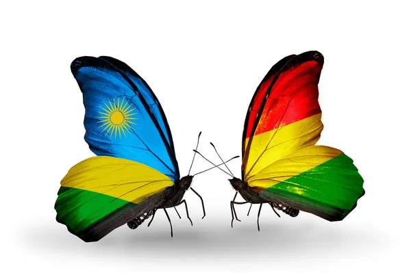 Butterflies with Rwanda and Bolivia flags — Stock Photo, Image