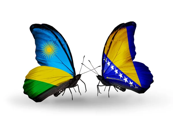 Borboletas com bandeiras de Ruanda e Bósnia e Herzegovina — Fotografia de Stock