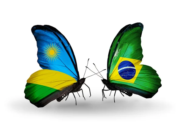 Butterflies with Rwanda and Brazil flags — Stock Photo, Image