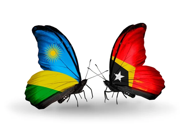 Kelebekler Ruanda ve Doğu Timor bayrağı ile — Stok fotoğraf
