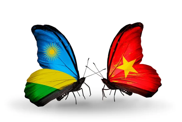 Butterflies with Rwanda and Vietnam flags — Stock Photo, Image