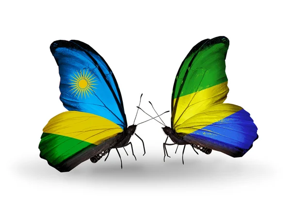 Butterflies with Rwanda and Gabon flags — Stock Photo, Image