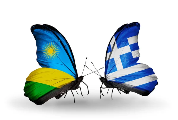 Schmetterlinge mit ruandischen und griechischen Flaggen — Stockfoto