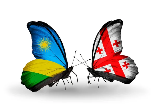 Motyle z Rwandy i Georgia flagi — Zdjęcie stockowe