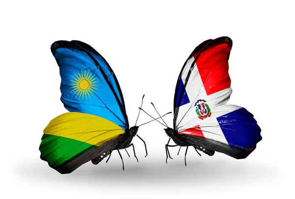 Butterflies with Rwanda and Dominicana flags — Stock Photo, Image