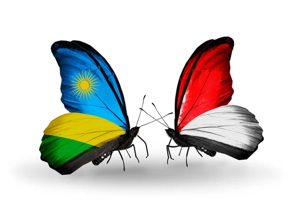 Borboletas com Ruanda e Mônaco, Bandeiras da Indonésia — Fotografia de Stock