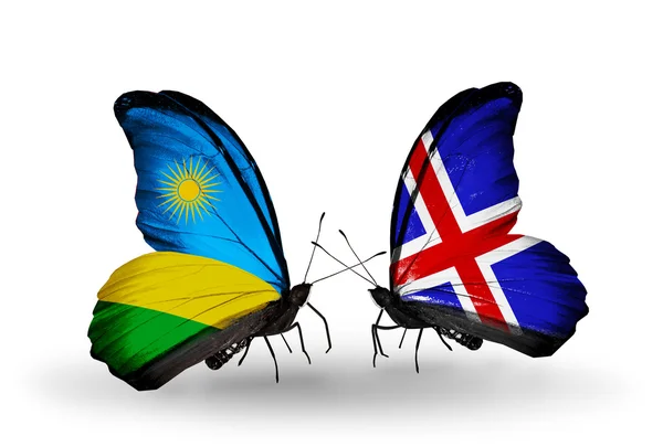 Butterflies with Rwanda and Iceland flags — Stock Photo, Image