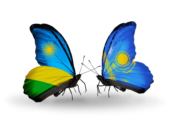 Schmetterlinge mit Ruanda und Kasachstan-Flaggen — Stockfoto