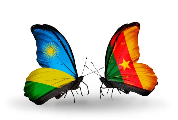 Butterflies with Rwanda and Cameroon flags — Stock Photo, Image