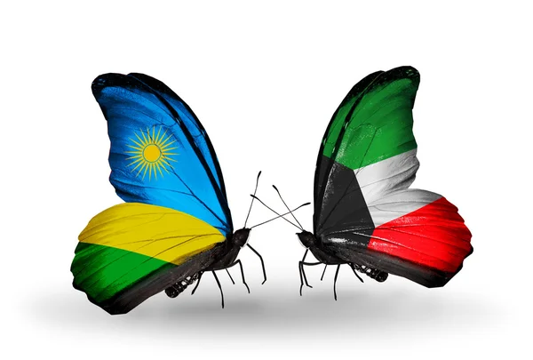 Бабочки с флагами Руанды и Кувейта — стоковое фото