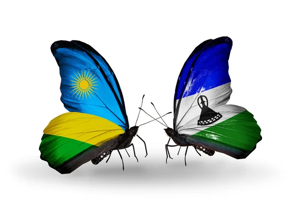 Papillons avec drapeaux du Rwanda et du Lesotho — Photo