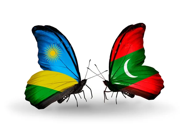 Butterflies with Rwanda and Maldives flags — Stock Photo, Image