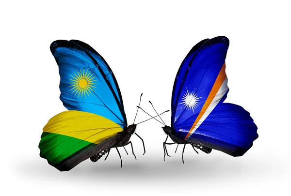 Butterflies with Rwanda and Marshall islands flag — Stock Photo, Image